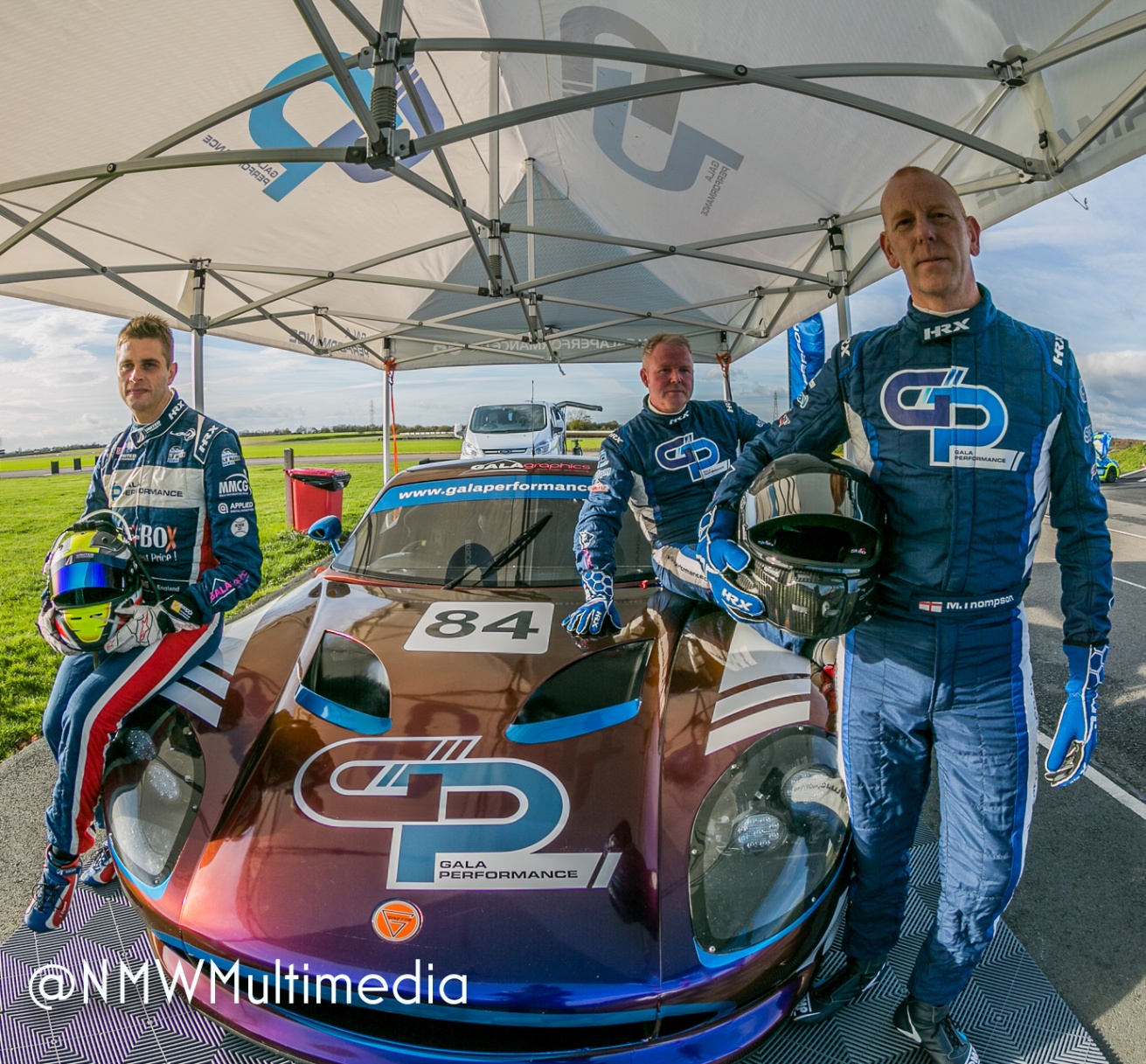 The Gala Performance racing team beside their endurance car.