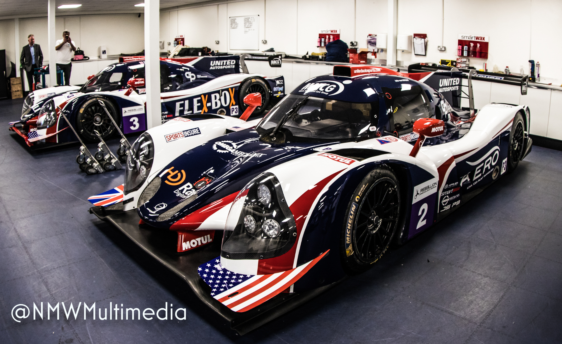 United Autosports Ligier JS P3 nose-to-camera in the workshop, stars and stripes on the dive plane.