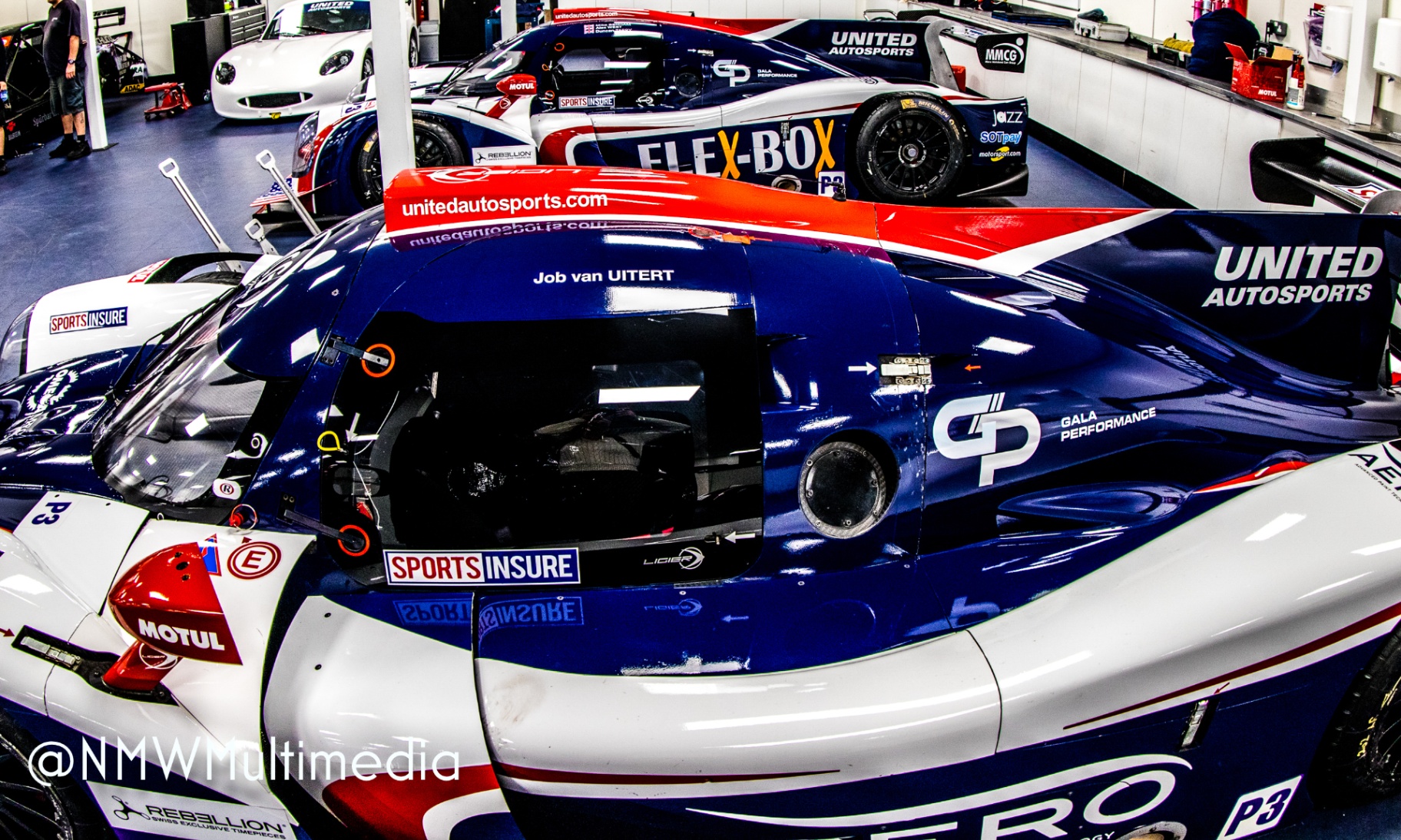 United Autosports Ligier prototypes resting in the garage between sessions.